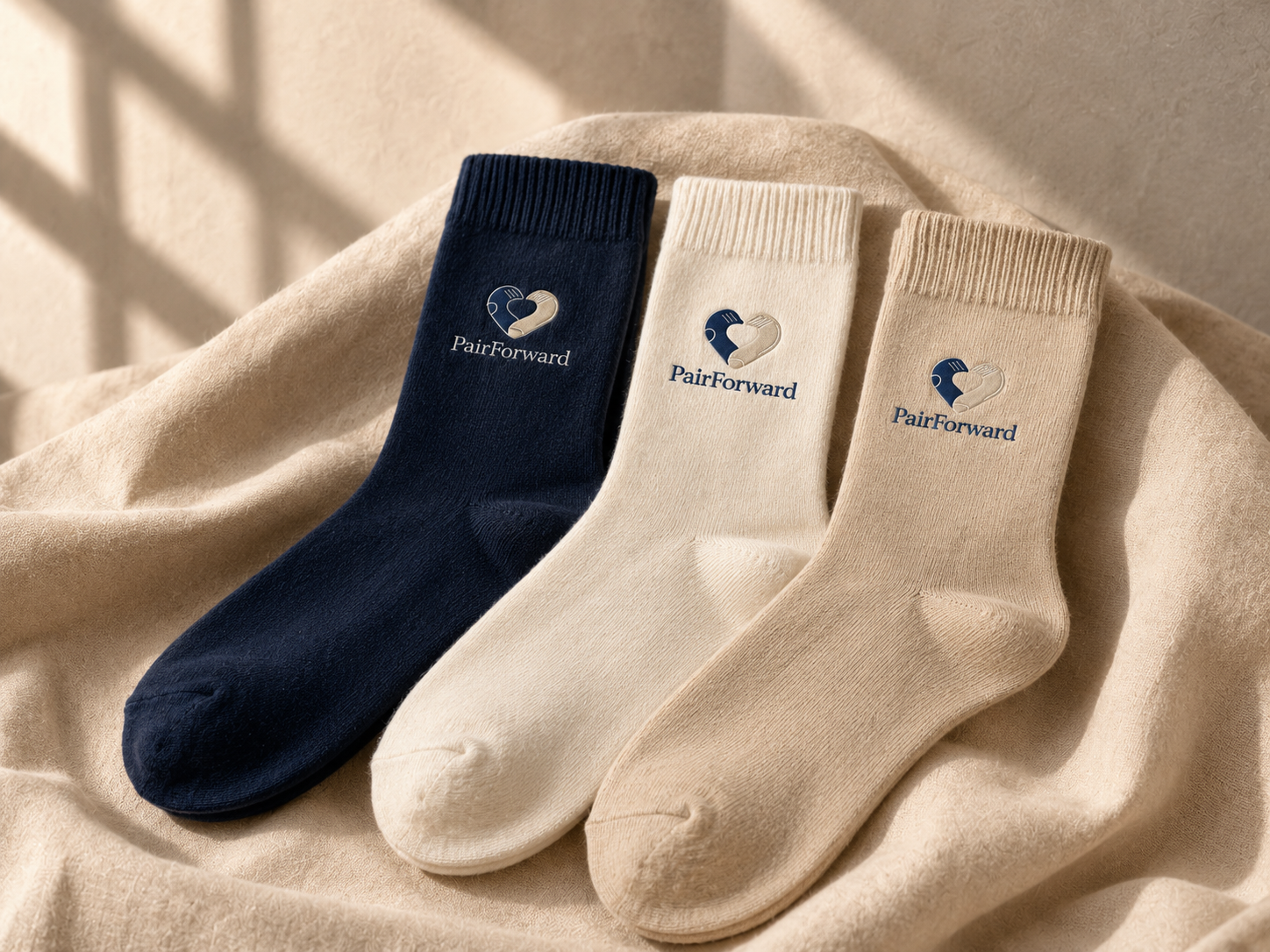 Custom branded corporate socks in navy, white, beige and black with woven company logos